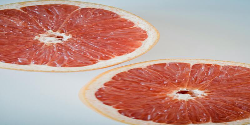 A close-up of a grapefruit slice AI-generated content may be incorrect.
